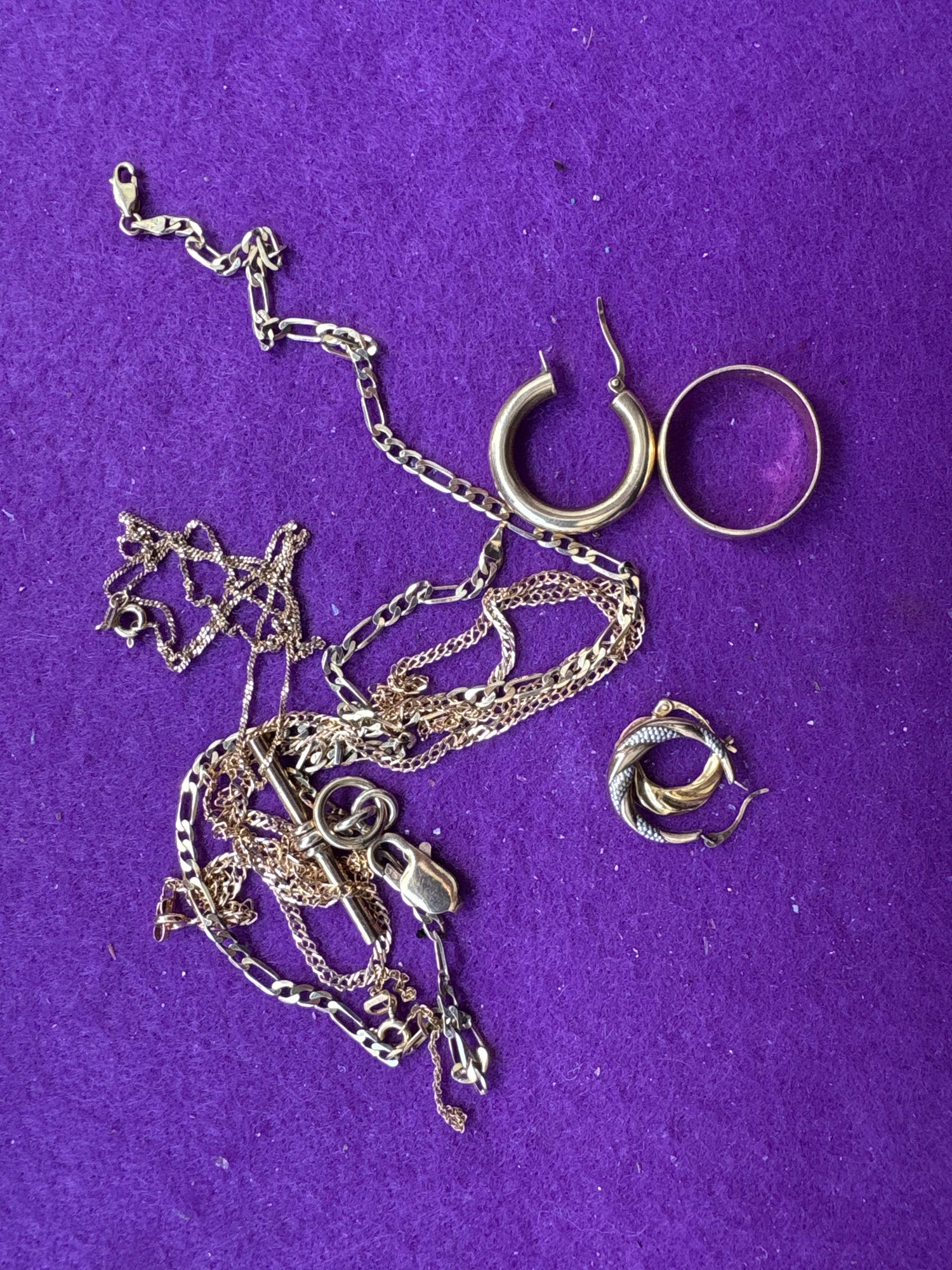 Old Gold necklace and earrings to sell on a purple surface